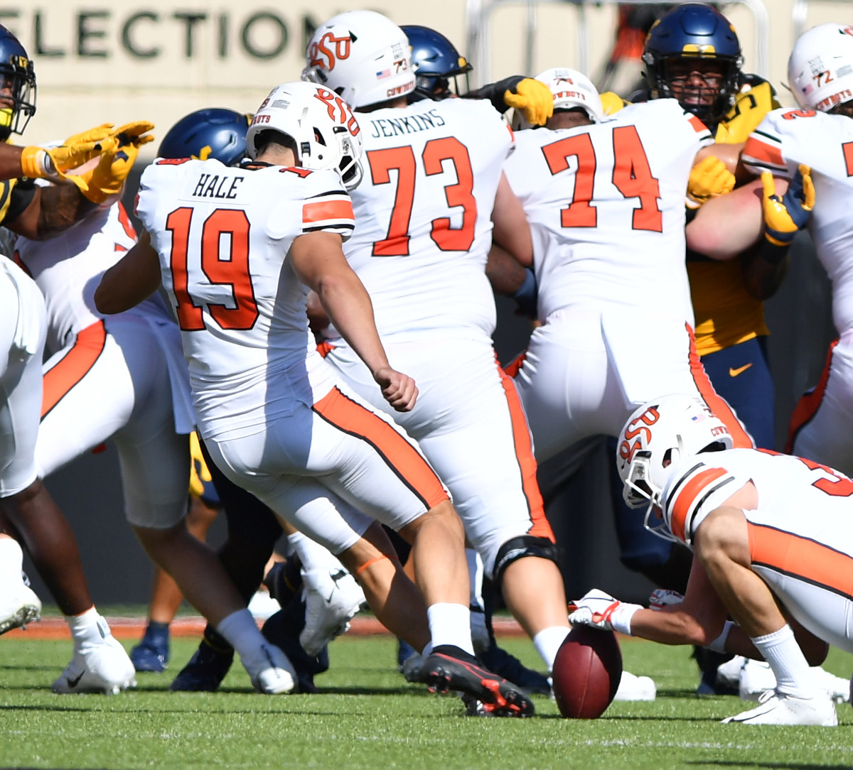 Alex Hale (19) kicking and Jake McClure holding against West Virginia earlier this season.